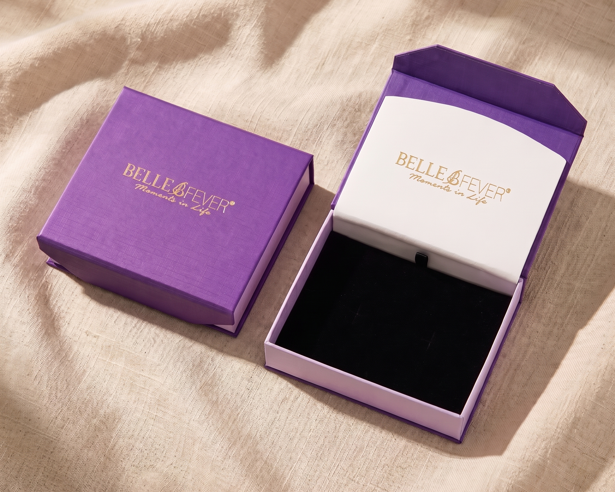 An open lined jewellery box with pieces separated into compartments