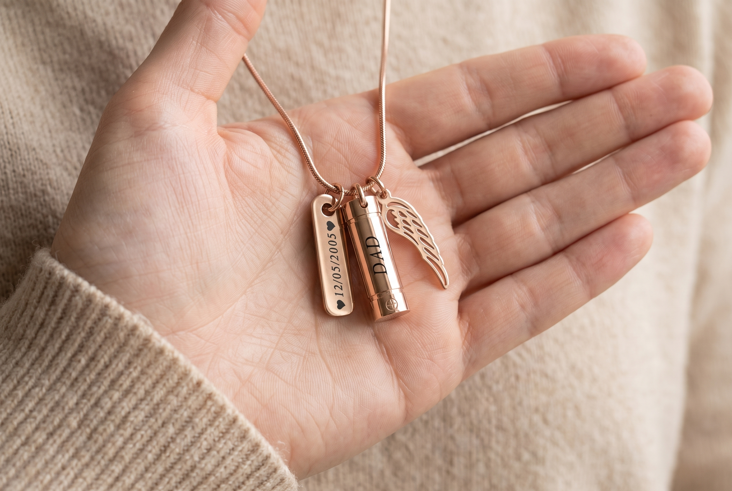 Woman's hand resting over an engraved heart memorial necklace