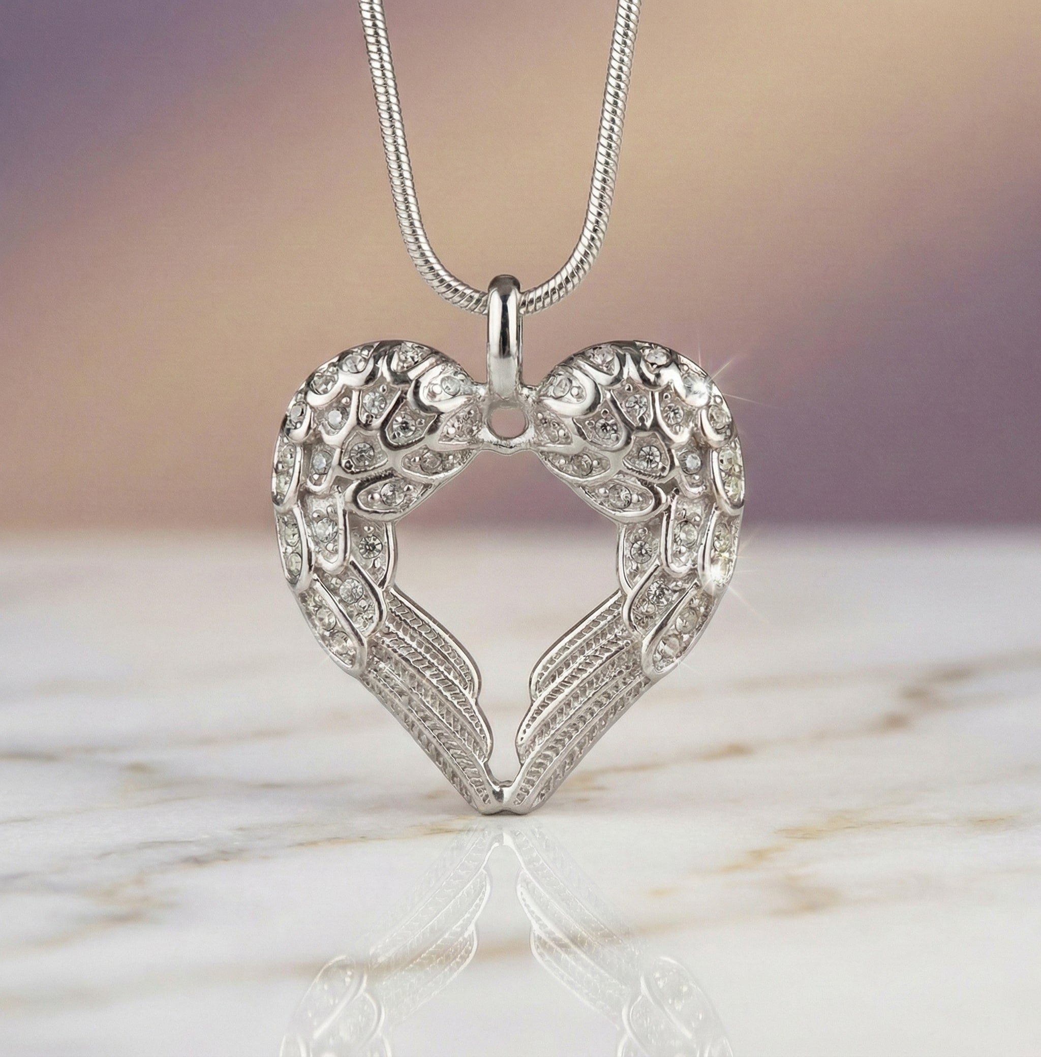 Belle Fever silver angel heart necklace, handcrafted symbolic jewellery representing love and protection