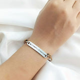 Belle Fever bar cord bracelet worn on wrist, personalised engraved bar bracelet with adjustable cord, meaningful unisex everyday jewelry.