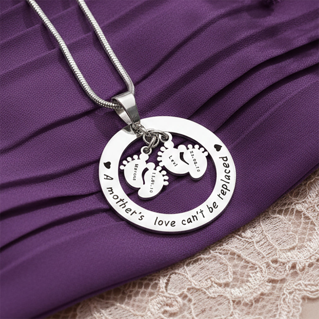 Close-up of Belle Fever Can't be replaced necklace showing engraved names and date, personalized keepsake jewelry for mothers
