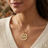 Belle Fever Can't be replaced necklace worn, featuring double baby feet charms with engraved name and date, sentimental family jewelry