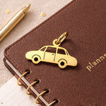 Belle Fever charm for keyring gold car pendant on leather background, premium driver gift for men, modern minimalist car keyring detail