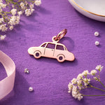 Belle Fever charm for keyring rose gold car pendant on purple fabric flat lay, feminine automotive keychain charm, aesthetic driver gift idea