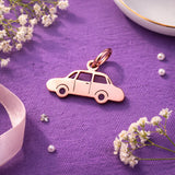 Belle Fever charm for keyring rose gold car pendant on purple fabric flat lay, feminine automotive keychain charm, aesthetic driver gift idea