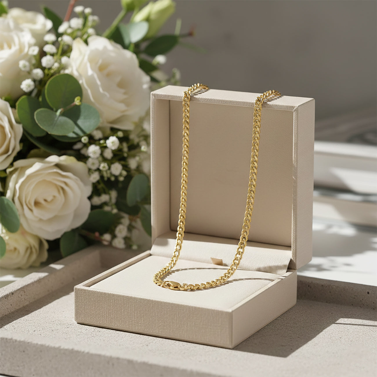 Gold curb chain necklace, waterproof non-tarnish unisex jewelry displayed elegantly, timeless everyday statement chain.