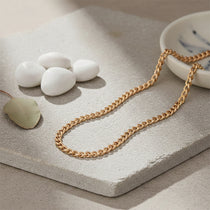 Premium gold curb chain necklace,  waterproof unisex jewelry designed for lasting shine and durability.