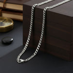 Waterproof curb chain necklace in silver, non-tarnish unisex jewelry laid flat, minimalist everyday chain by Belle Fever.