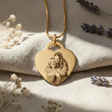 Forever in My Heart Photo Necklace by Belle Fever — gold heart pendant with personalised photo engraving, styled on fabric with gentle florals, a timeless keepsake honouring deep connection.