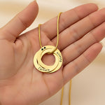 Belle Fever Family Love Circles Necklace — personalised interlinked gold rings held gently in hand, engraved with meaningful names to honour family connections.