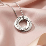 Belle Fever Interlinked Family Love Circles Necklace — silver personalised circle pendant engraved with meaningful dates and names, styled on soft fabric to symbolise lasting family bonds.