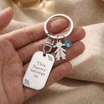 Kids Love Heart Keyring held in hand with engraved heart disc and child charm, personalised keepsake gift