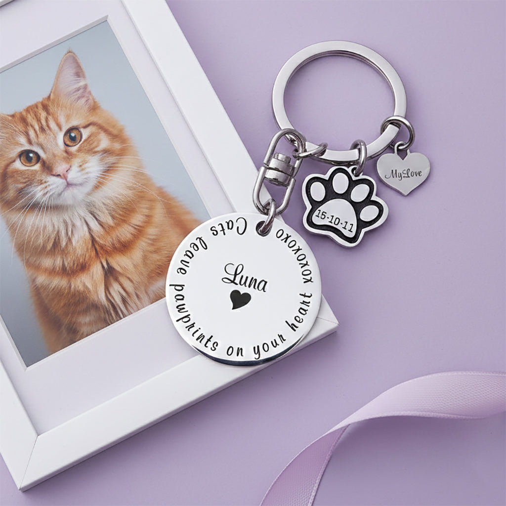 Personalized prints on my heart keyring, pet memorial keychain displayed near pet photo with engraved name disc and paw charm. belle fever meaningful pet tribute keepsake.