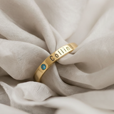 Belle Fever Stackable Birthstone Ring in gold — engraved name band with sparkling birthstone, a delicate keepsake representing love and treasured memories.