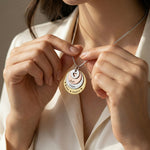 Belle Fever Tower of Love necklace worn by a model, showcasing the layered charm pendant design