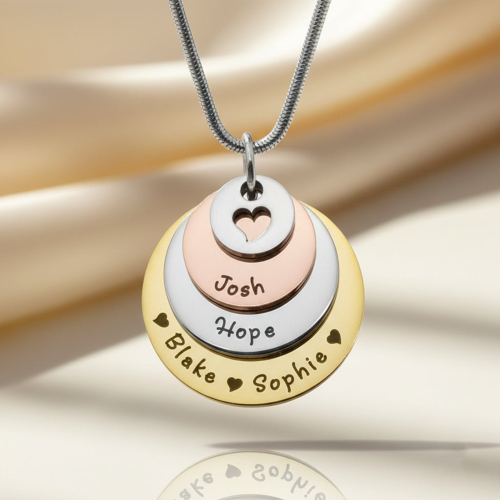 Tower of Love necklace featuring stacked engraved charms on a delicate chain, shown in soft lighting, Belle Fever Jewellery