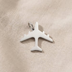 Silver airplane charm for keyring symbolizing travel memories, adventure, and meaningful journey keepsakes