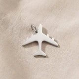 Silver airplane charm for keyring symbolizing travel memories, adventure, and meaningful journey keepsakes