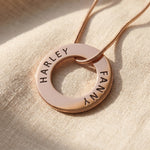 Always Forever necklace in gold with engraved names on circle pendant, refined personalised jewellery