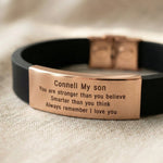 Close up of Always Remember personalised ID bracelet showing engraved message on metal plate