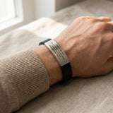 Man wearing Always Remember personalised ID bracelet with engraved plate on silicone band