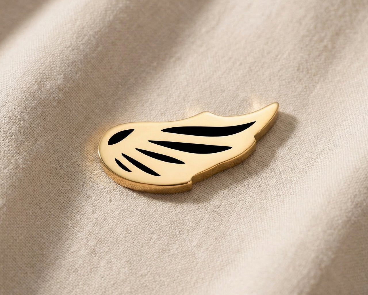 Gold angel wing charm for Dream Locket bracelet symbolizing protection, remembrance, and spiritual connection