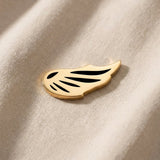 Gold angel wing charm for Dream Locket bracelet symbolizing protection, remembrance, and spiritual connection
