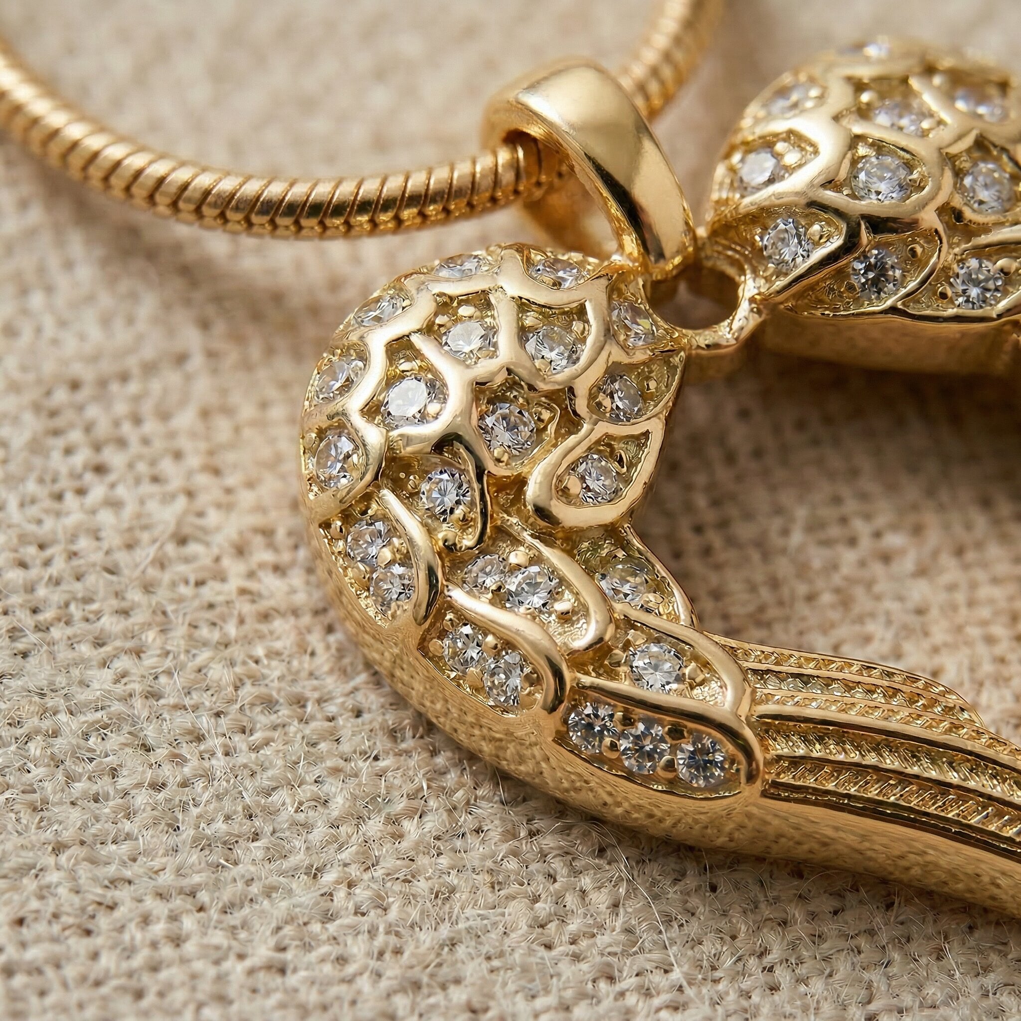 Close up of Angels Heart necklace heart pendant with angel wings detail and gemstone accents