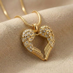 Angels Heart necklace with gold heart angel wings pendant on delicate chain displayed on neutral background
