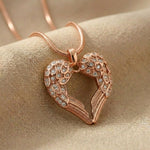 Angels Heart necklace in rose gold with heart angel wings pendant on delicate chain
