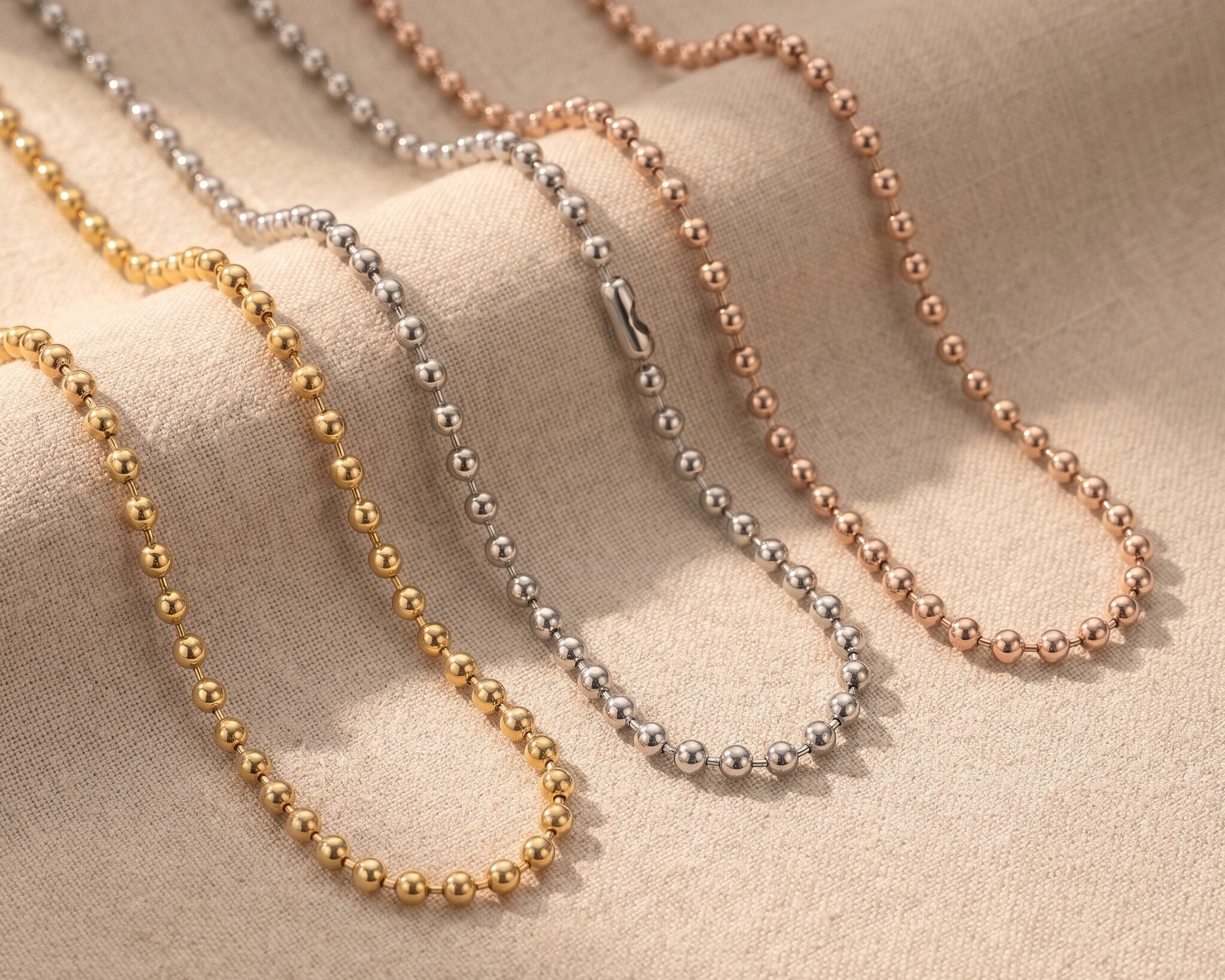Ball chain necklace tone comparison showing gold, silver and rose gold minimalist chain jewellery finishes
