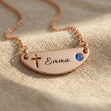 Beck name necklace showing cross design option with engraved name and birthstone detail