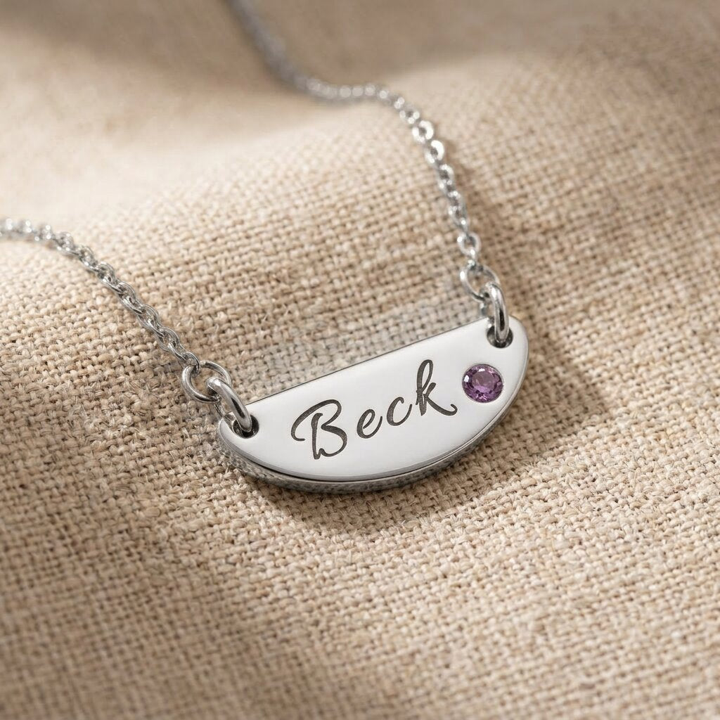 Silver Beck name necklace with engraved bar pendant and birthstone detail