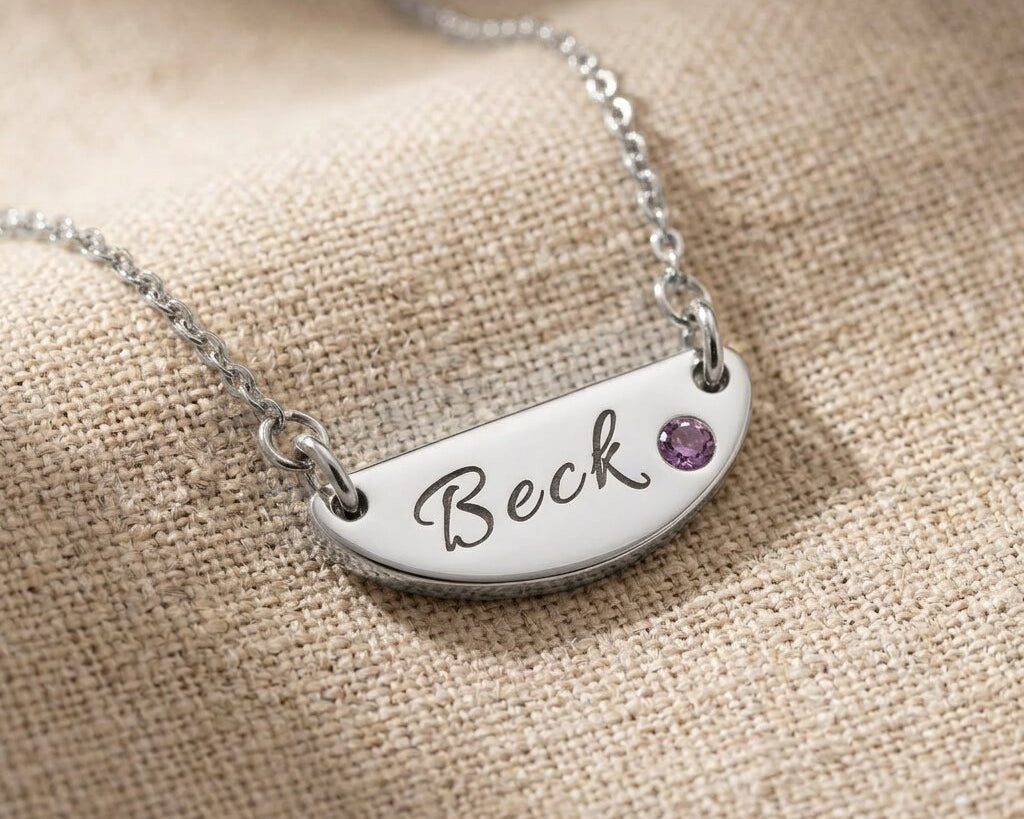 Silver Beck name necklace with engraved bar pendant and birthstone detail