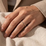 Woman wearing blushing ring stack, delicate beaded ring set styled as everyday jewellery for her