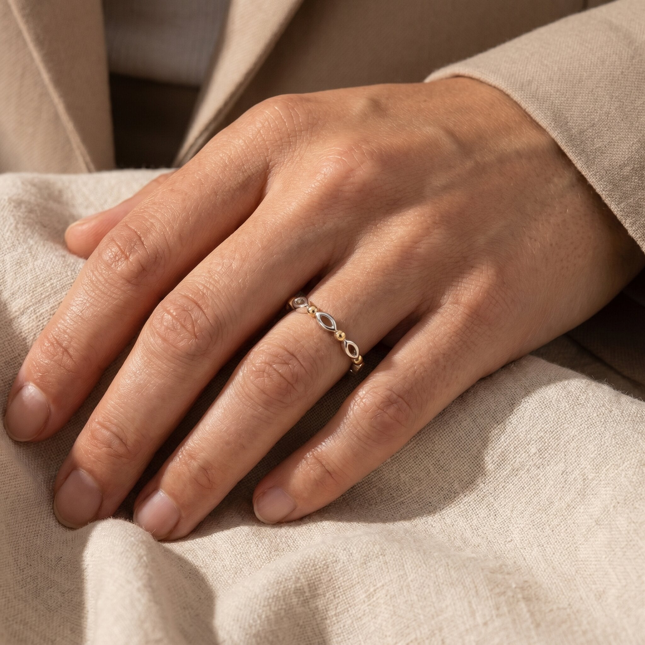 Woman wearing blushing ring stack, delicate beaded ring set styled as everyday jewellery for her