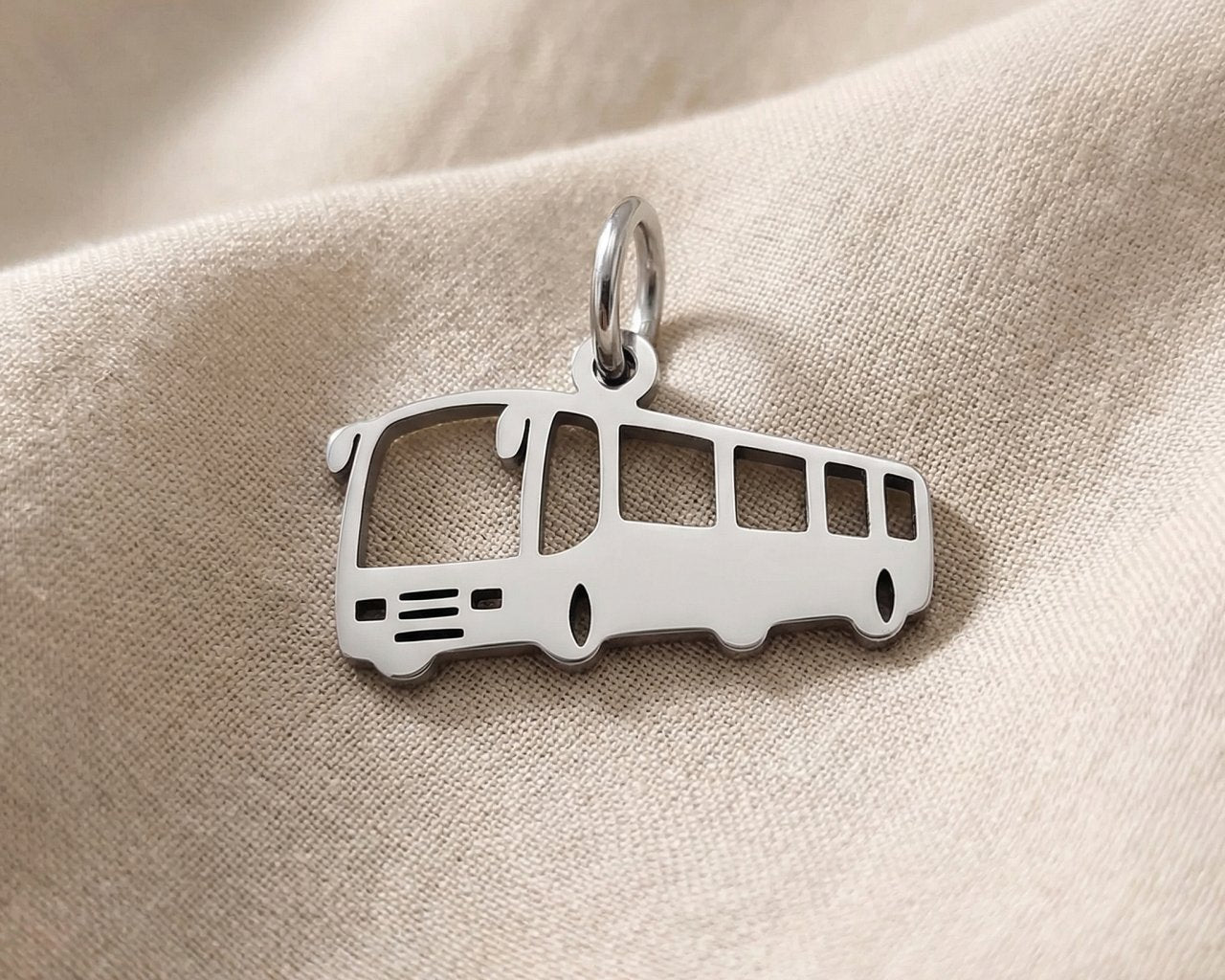 Silver bus charm for keyring symbolizing travel memories, daily journeys, and transportation-inspired keepsakes