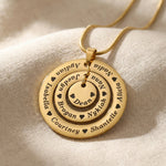 Gold Circle of Loved Ones necklace on delicate chain in neutral background 
