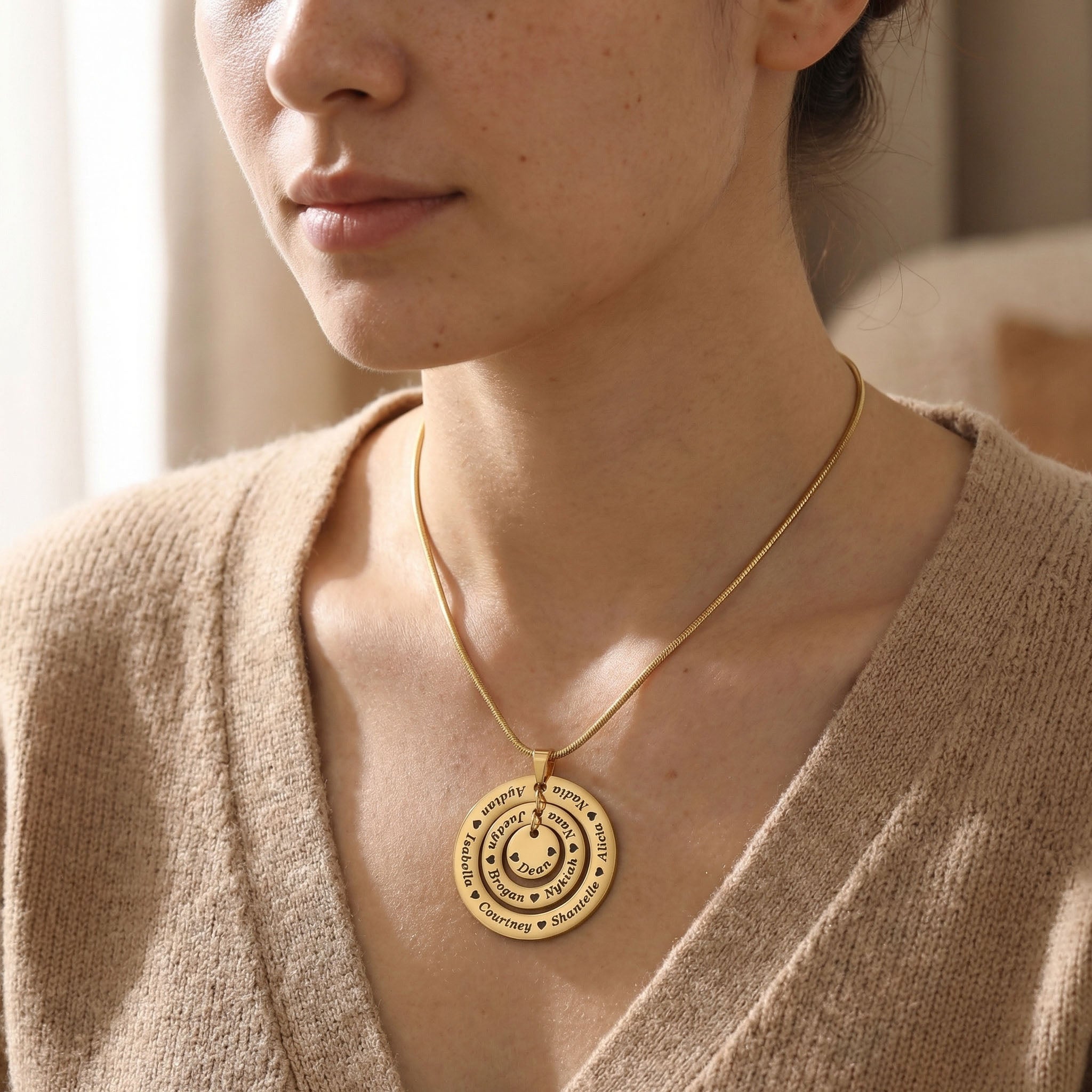 Woman wearing Circle of Loved Ones necklace with personalised engraved pendant