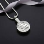Belle Fever silver Circle Cremation Necklace, round engraved memorial pendant for ashes, personalised remembrance jewellery keepsake, modern sympathy gift styled on dark background.