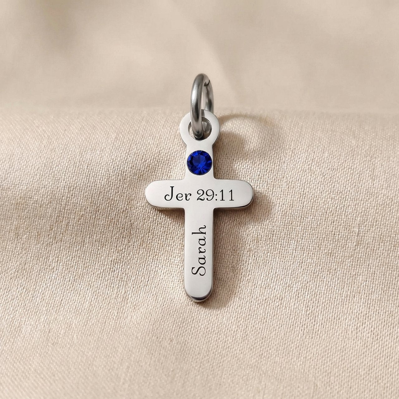 Silver cross birthstone charm for keyring combining faith symbolism with personalized gemstone keepsake detail