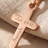 Close up of cross name necklace showing engraved name detail on cross pendant