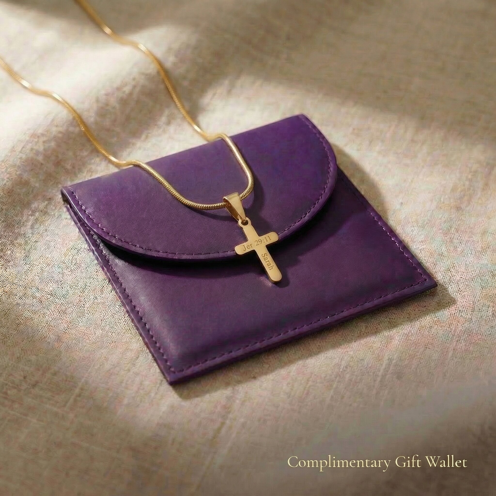 Cross name necklace displayed with elegant jewelry gift wallet packaging