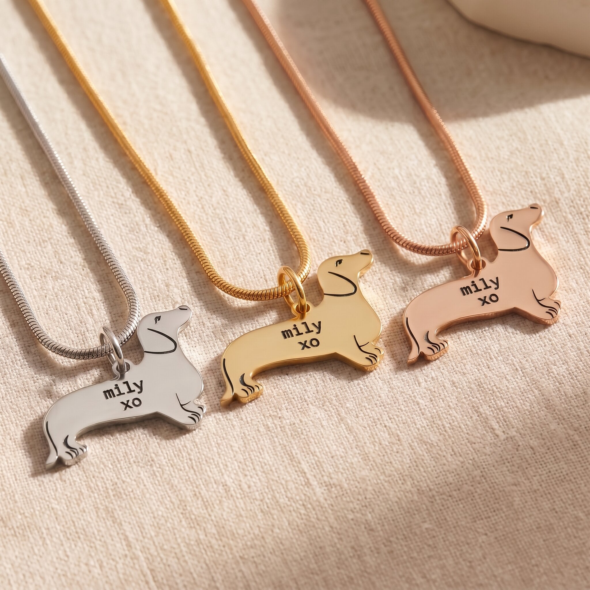 Dachshund dog necklace tone comparison showing gold, silver and rose gold engraved finishes