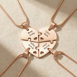 Heart Puzzle Necklace in rose gold with four interlocking engraved pieces forming heart design