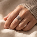 Woman wearing personalized double name ring with elegant custom lettering and minimalist jewelry styling