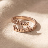 Personalized double name rose gold ring with custom engraved lettering and elegant modern jewelry style
