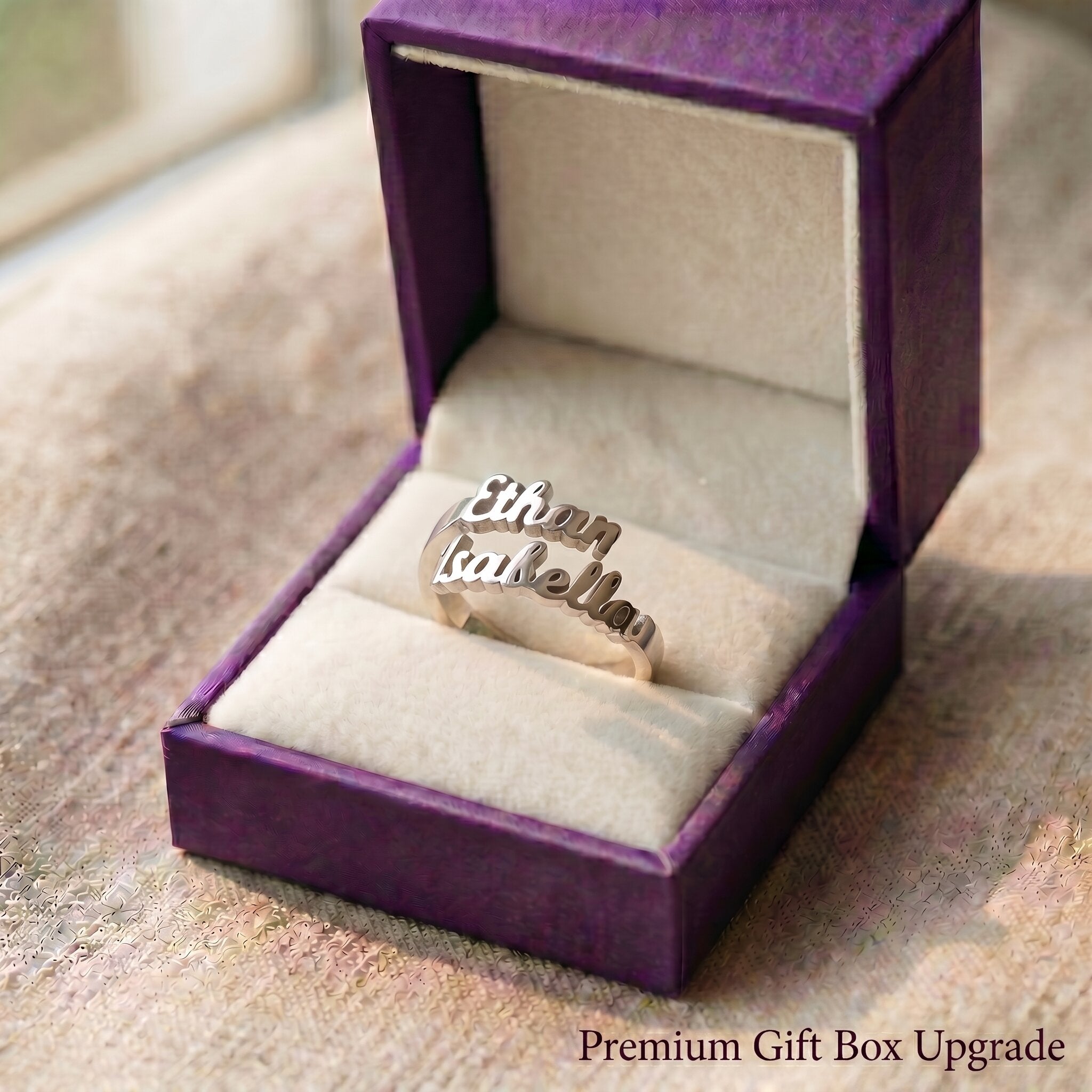 Personalized double name ring presented in luxury purple gift box for meaningful jewelry gifting moments