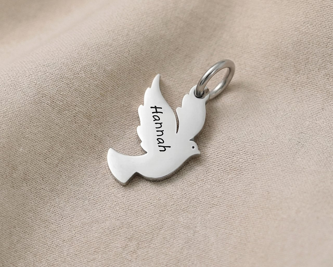 Silver dove charm for keyring symbolizing peace, hope, remembrance, and meaningful spiritual connection