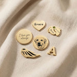 Dream locket charms in gold showing personalised inserts, initial charm, pet photo and engraved message options